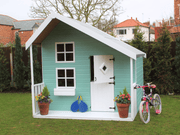 Children's Play House painted in blue with white accents, viewed from the front