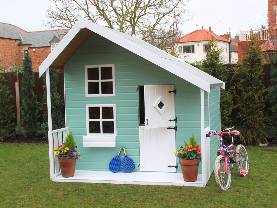 Children's Play House painted in blue with white accents, viewed from the front