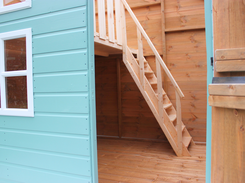 Interior of children's playhouse with staircase. 