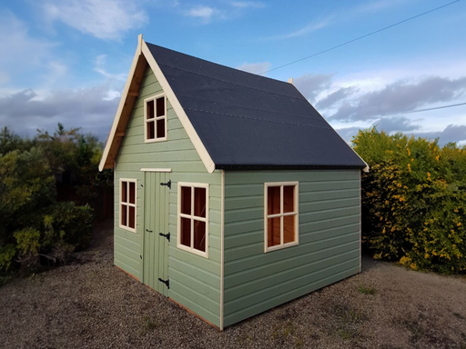 Aiden's Mansion two-storey children's playhouse, painted green with white accents.