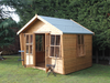 Wooden summerhouse with large opened double doors and opening windows, viewed from the front/right side. 
