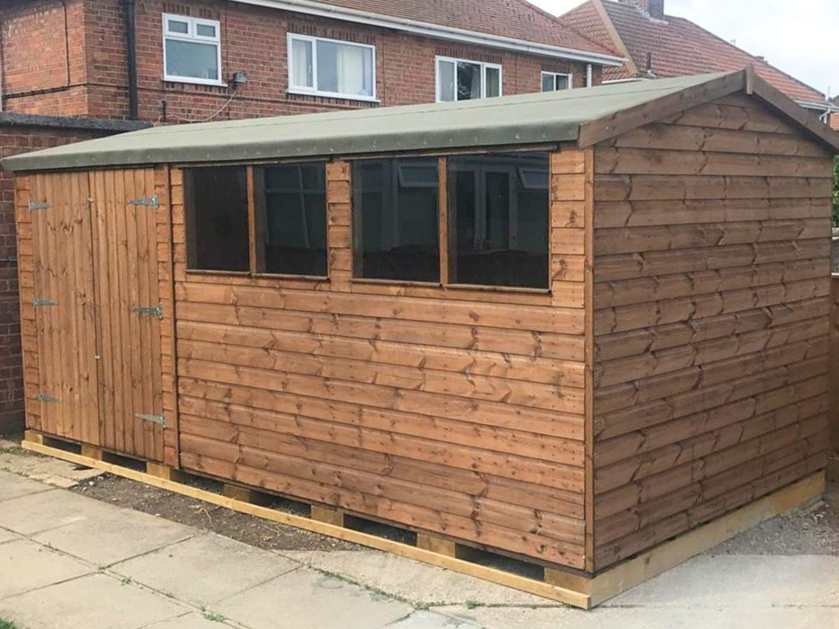 Apex Workshop with double doors and two sets of double windows, viewed from an angle to the right