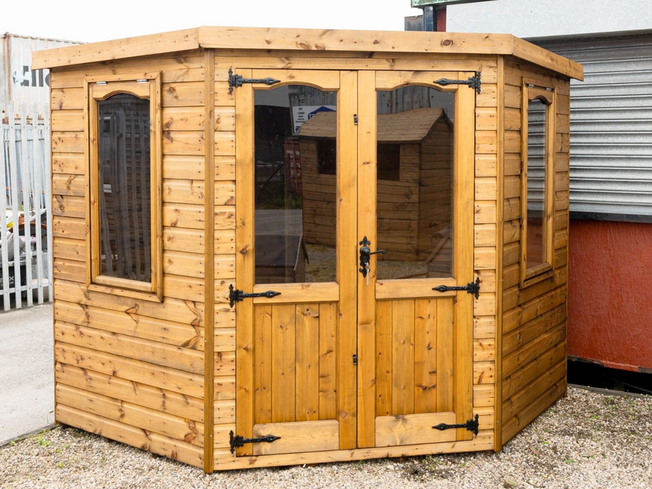 Beaumont Corner Summerhouse viewed from the front, featuring double doors and two opening side windows