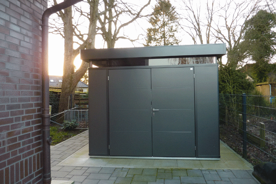 CasaNova steel garden building in a happy customer's garden