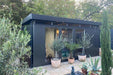 CasaNova steel garden building in a happy customer's garden in metallic dark grey finish