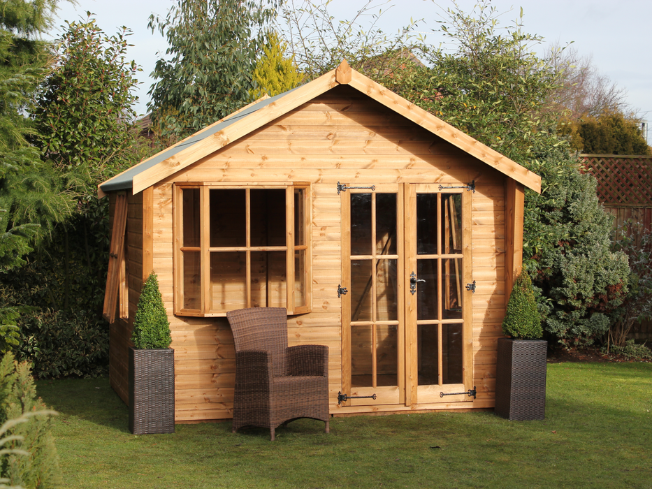 Wooden Summerhouse with large bay window, double doors with windows, viewed from the front. 