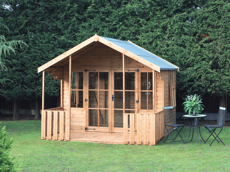 Wooden summerhouse with large double doors, tall windows, and a veranda / porch area. Viewed from the front. 