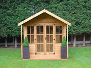 Classic wooden summerhouse with large double doors, viewed from the front. 