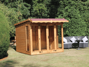 Wooden summerhouse with red roof tiles, large double doors, large front and side windows viewed from the left side. 