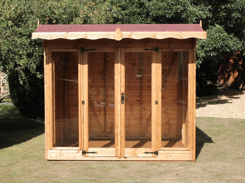 Wooden summerhouse with red roof tiles,  large double doors and front windows, viewed from the front. 