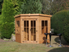 Wooden corner summerhouse with large double doors, large side windows, from from the front/right side.