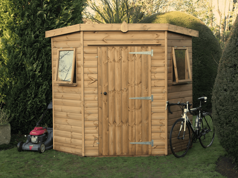 Wooden corner shed with single door, side opening windows, viewed from the front. 