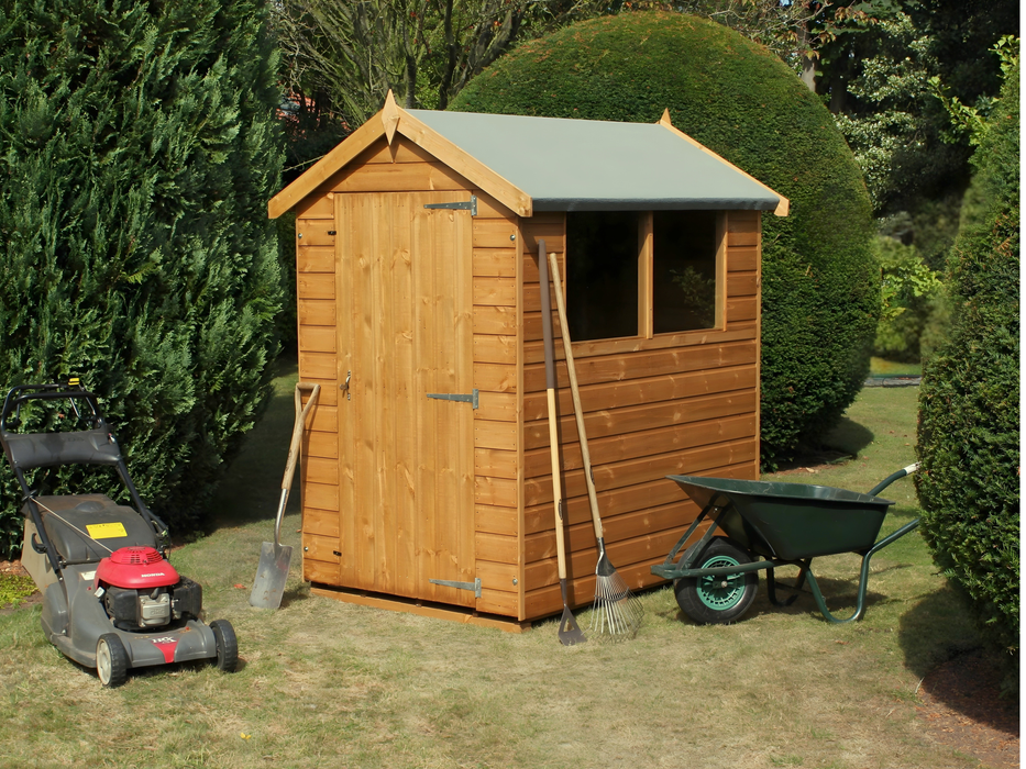 Classic wooden shed with apex style roof, single door at the front, 2 side windows. Viewed from the front/right side. 
