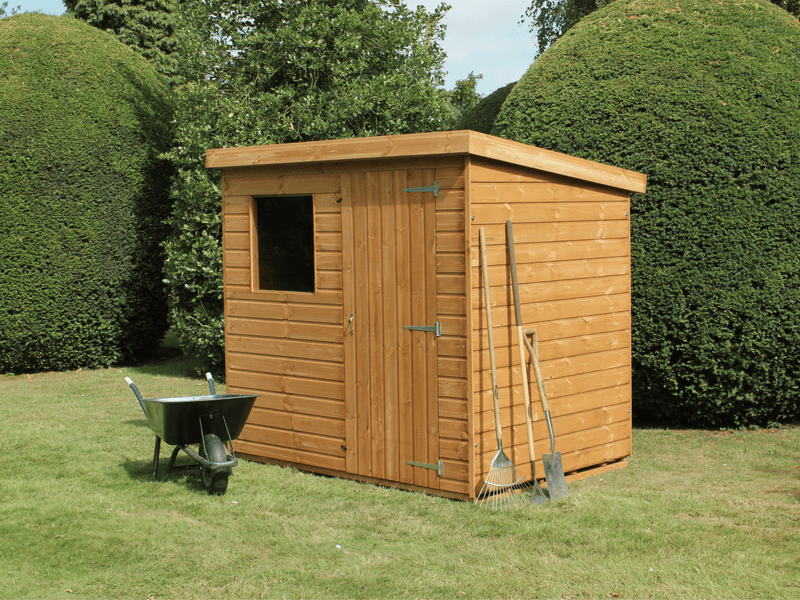 Classic wooden shed with pent style roof, single door at front, single window at front. Viewed from the front/right side. 