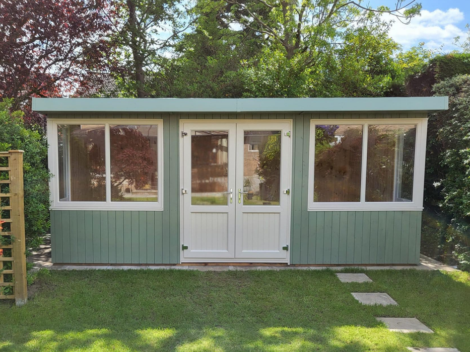 Deluxe Summerhouse / Office with UPVC double doors and large corner windows, painted in a green finish and viewed from the front