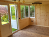 Internal view of the Deluxe Summerhouse / Office with UPVC double doors and large corner windows