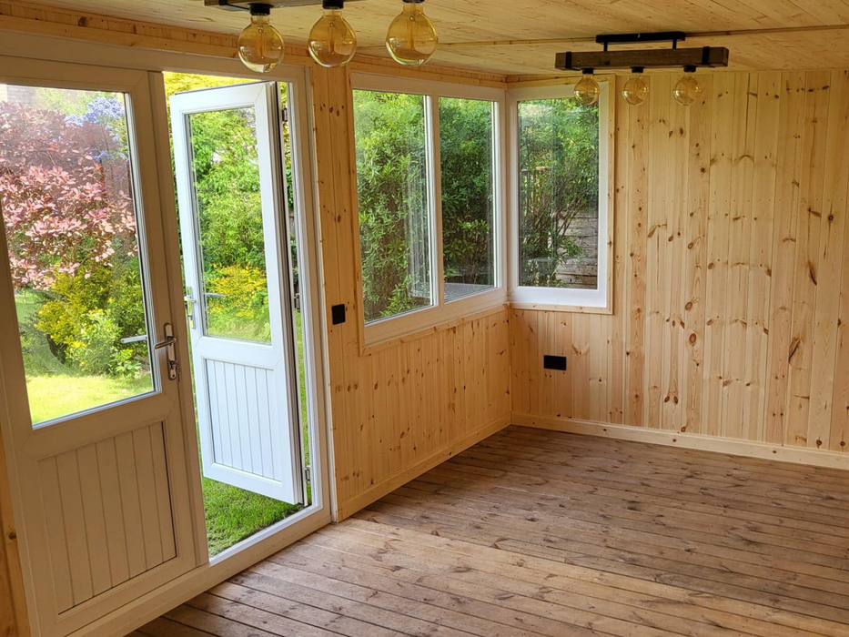 Internal view of the Deluxe Summerhouse / Office with UPVC double doors and large corner windows