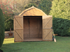 Large, tall wooden shed with double doors opened showing the interior. 