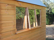 Close up of side opening window on the right side of the dutch barn.