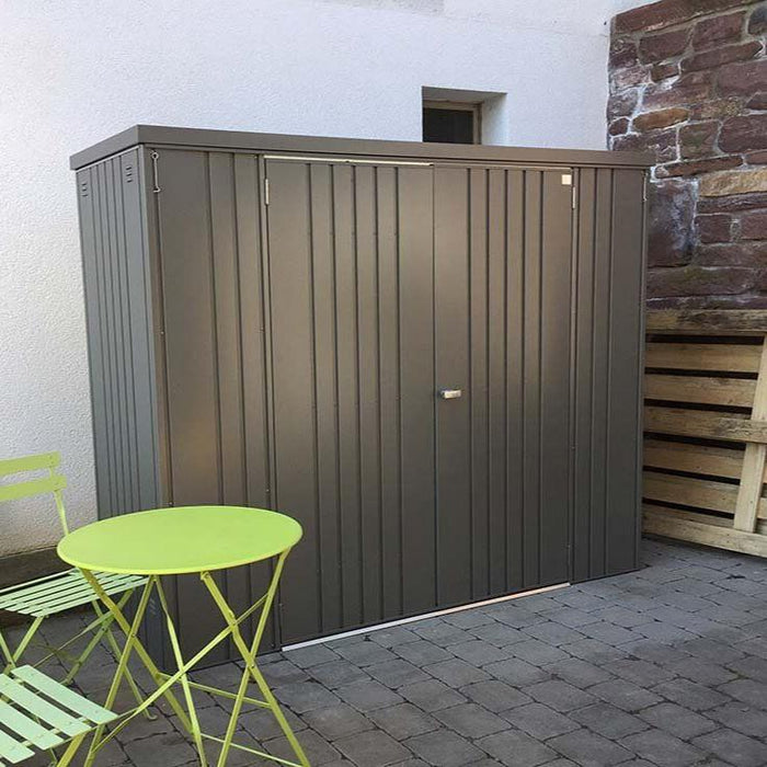 Steel equipment locker in a happy customer's garden with double doors