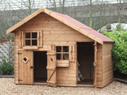 Large wooden children's playhouse, with shorter double doors and taller single door opened showing interior, two acrylic windows, viewed from the front. 
