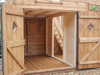Close up of shorter double doors opened, showing stairs in the interior and seperate rooms. 