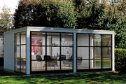 Large, white, wooden summerhouse with glass walls. Viewed from the front/left side.