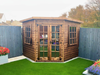 Georgian Corner Summerhouse with double doors and two opening side windows, in a natural timber finish and viewed from the front