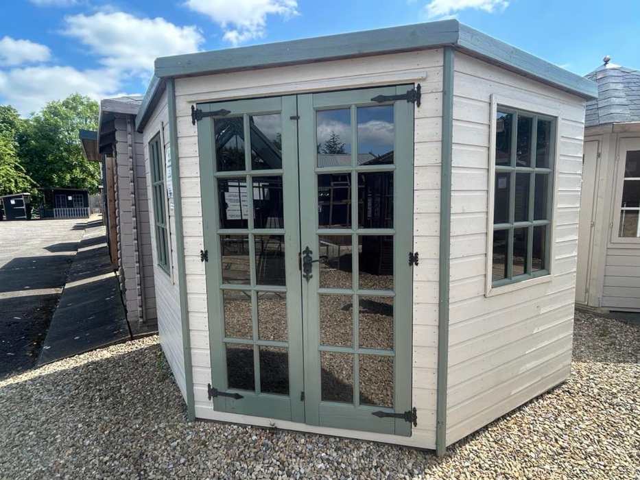Georgian Corner Summerhouse with double doors and two side windows, painted white with green accents and viewed from the front