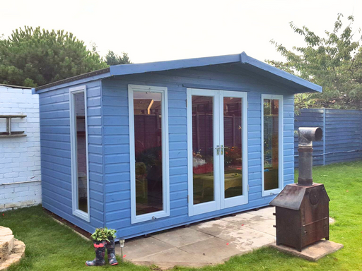 The Hampshire Summerhouse with double doors and four side windows, painted in blue and viewed from the left