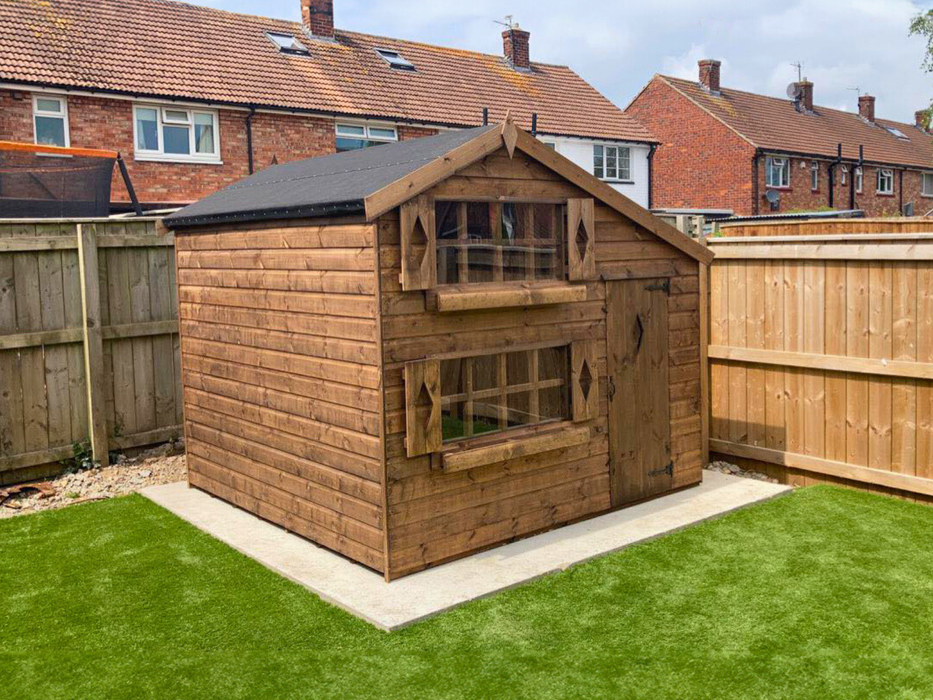 Harrison's Den two-storey children's playhouse viewed from the left