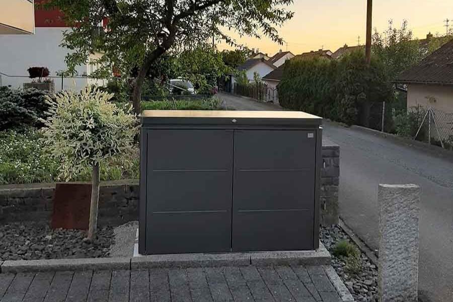 Highboard steel outdoor storage box in a happy customer's front garden