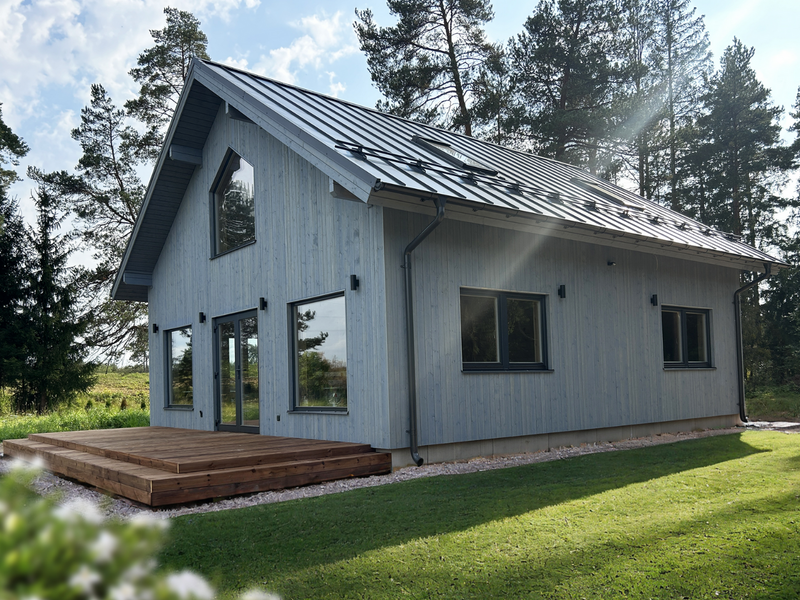 Lars two-storey residential log cabin, viewed from the left