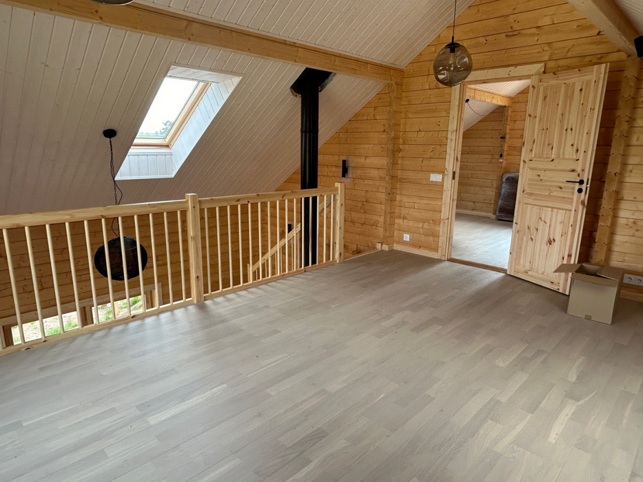Interior view of the upper landing area in the Lars two-storey residential log cabin