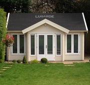 Large wooden log cabin with with tall windows, double doors, apex-style roof. Viewed from the front. 
