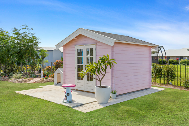 Pink, wooden log cabin with apex-style roof, double doors. Viewed from the front/right side.