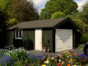 Large, black, wooden garage with white double doors, single door and window. Viewed from front/right side. 