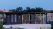 Large, black summerhouse with double doors, canopy area on right side with slatted panels. Viewed from the front. 