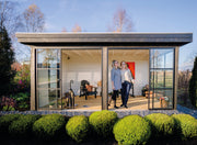 Spacious wooden summerhouse with large glass sliding doors. Viewed from the front. 