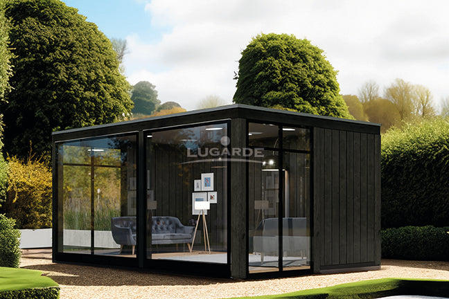 Large, black wooden summerhouse with glass walls at front. Viewed from the right.