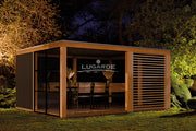 Large, open wooden summerhouse with glass wall, slatted pannels. Viewed from the front/left side.