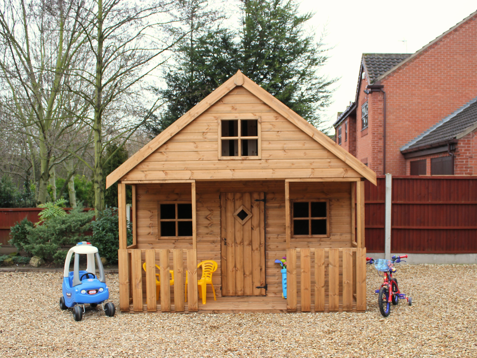 Large wooden playhouse with two levels, single door, multiple windows, viewed from the front. 