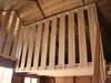 Interior of wooden playhouse, safety barrier of the second level. 