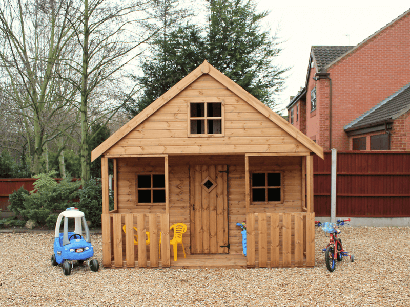 Large wooden playhouse with two levels, single door, multiple windows, viewed from the front. 