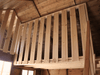 Interior of wooden playhouse, safety barrier of the second level. 