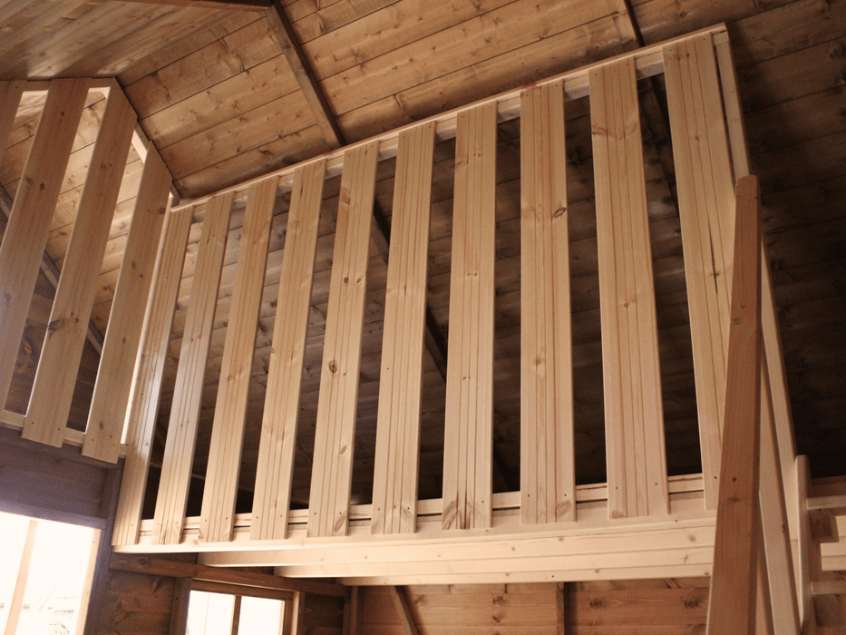 Interior of wooden playhouse, safety barrier of the second level. 