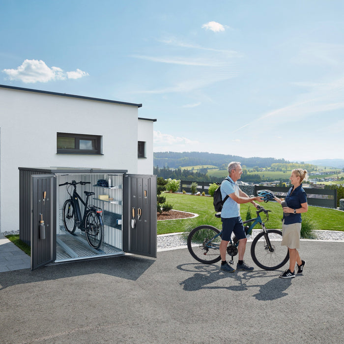 MiniGarage steel outdoor bike store in metallic dark grey finish, open to show multiple storage solutions inside