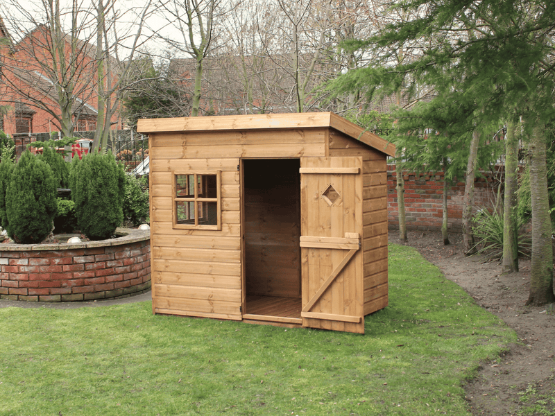Wooden playhouse with 1 front window and opened single door showing the interior. Viewed from the front/right side. 