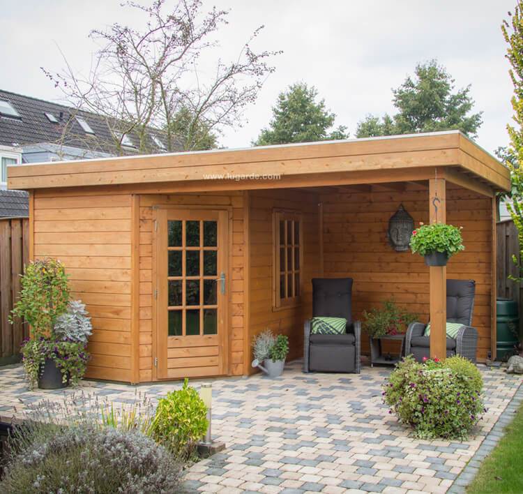 Wooden pentagonal summerhouse with canopy on right side. Viewed from the front. 