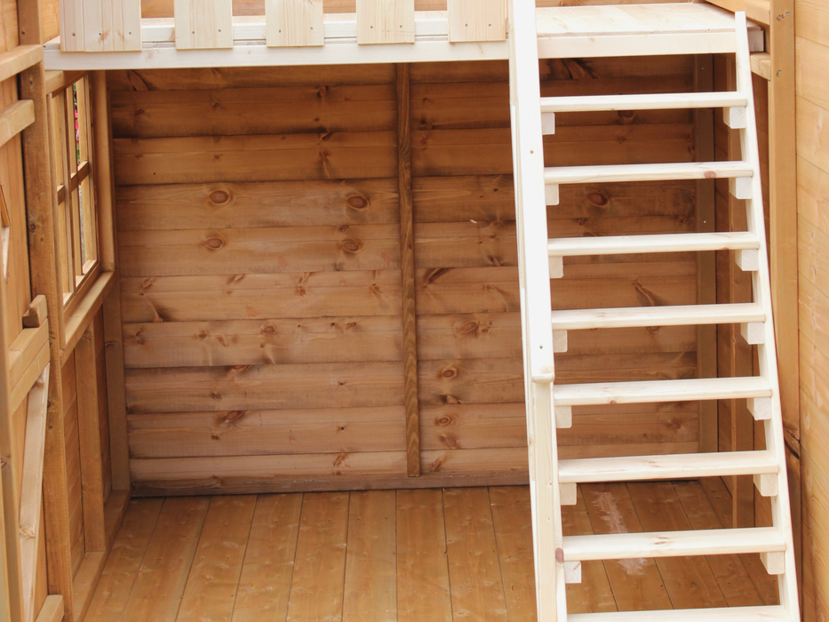 Close up of wooden staircase leading to the 2nd level of wooden playhouse.